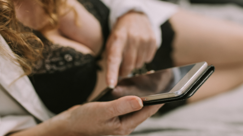 woman in sexy clothes with mobile phone