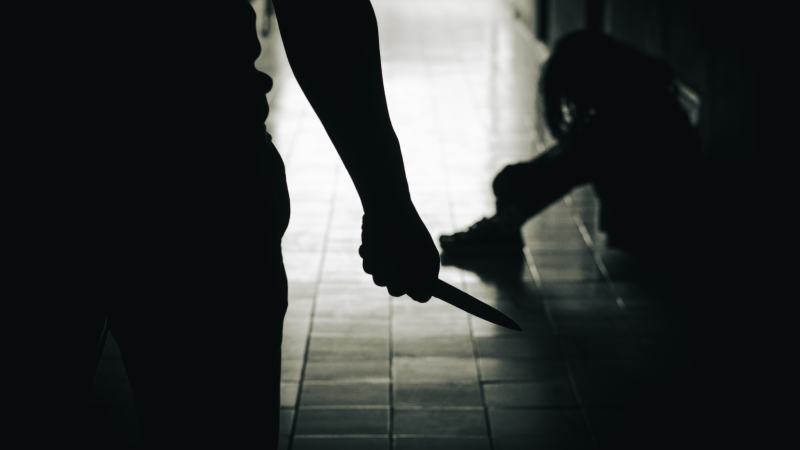 The murderer is holding a knife trying to hurt a weak woman. ignorant life problems Ready to use family violence concept of women's violence problem